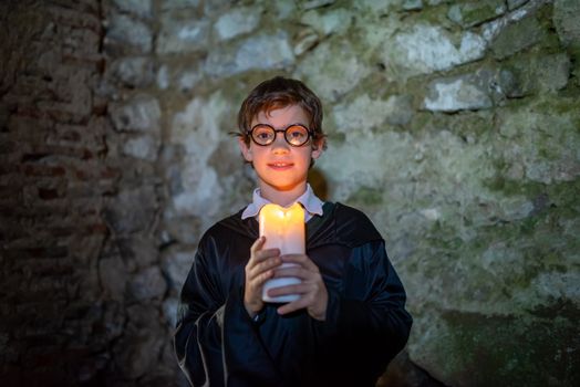 A Boy Holding a Lighted Candle