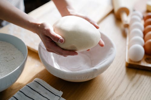 Close Up Shot of a Dough on Person's Hands
