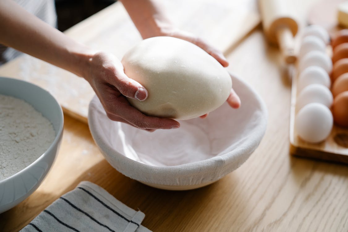 Close Up Shot of a Dough on Person's Hands