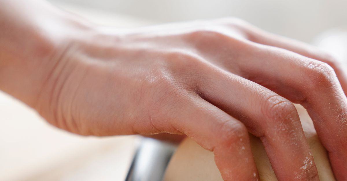 Hand Holding Dough Free Stock Photo hand-holding-dough-free-stock-photo