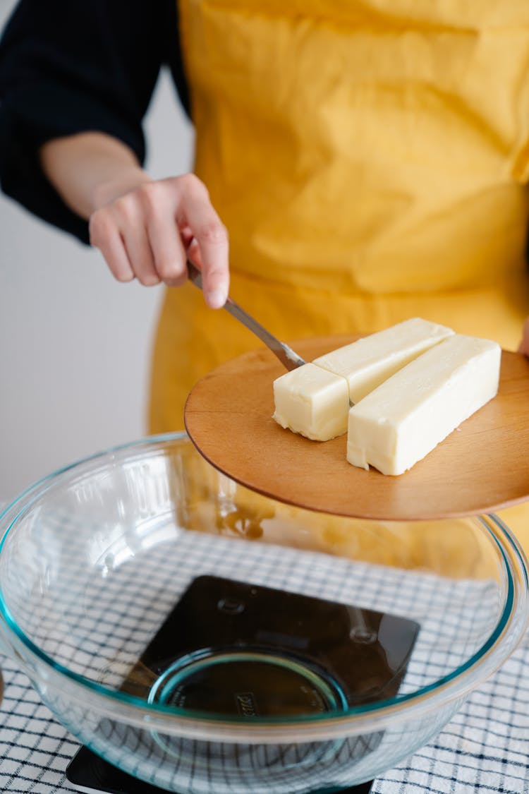 Close-Up Shot Of A Person Slicing A Butter