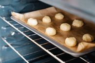 Rounded Dough on Baking Tray Place in an Oven