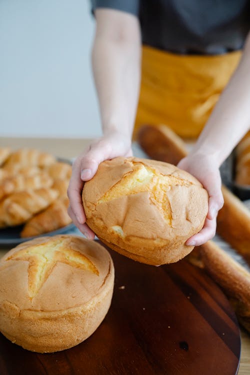 Woman Holding Freshly Baked Buns