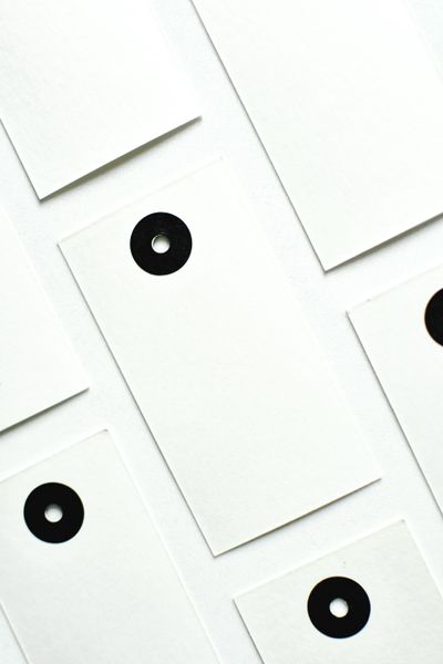 Metal eyelets on tags