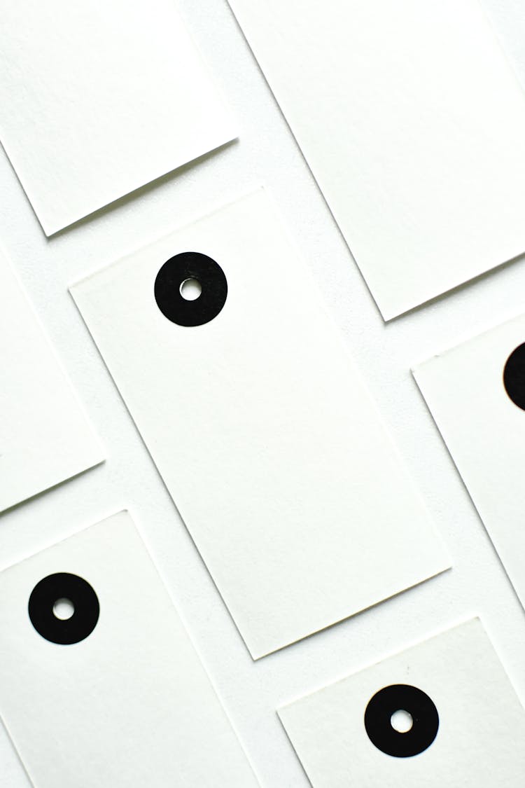 Black Rimed Holes On White Cards