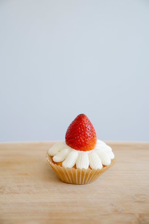Close-Up Shot of a Cupcake with Strawberry