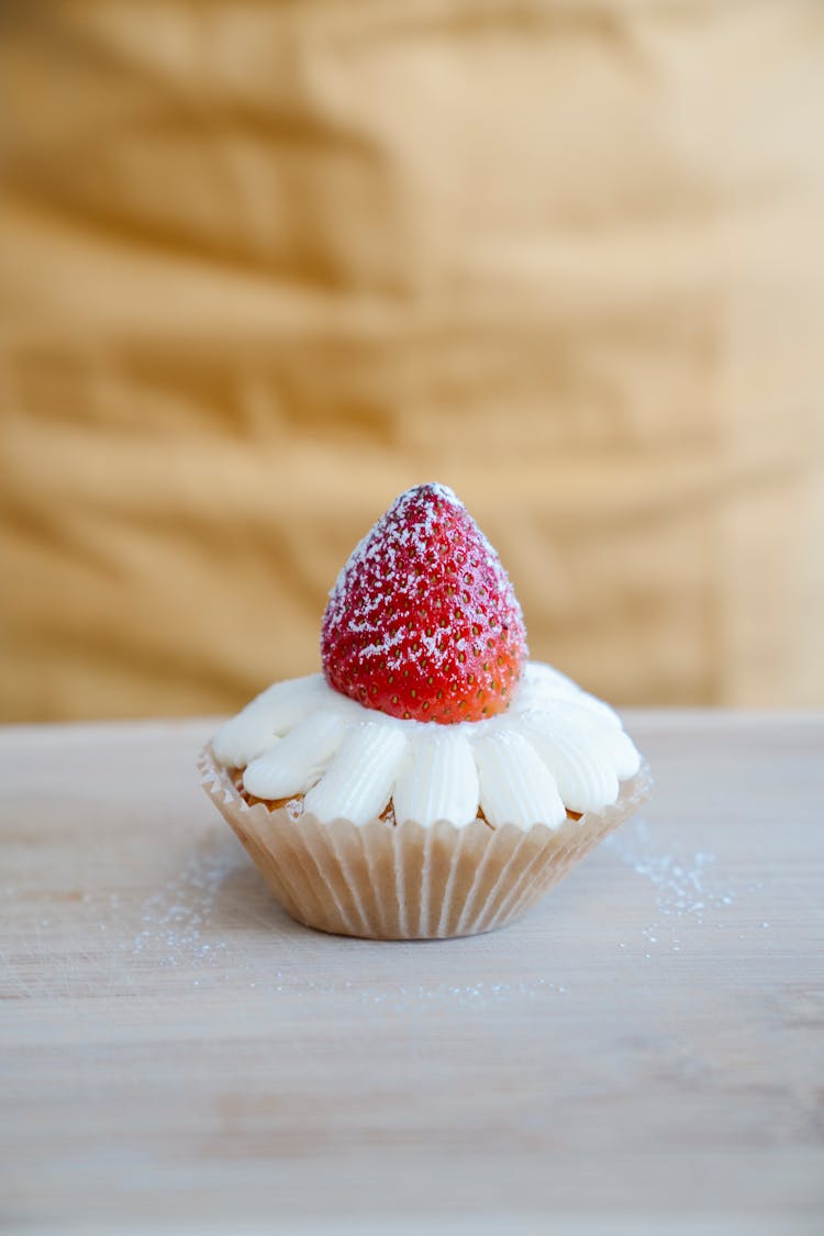 Close-Up Shot Of A Delicious Strawberry Cupcake