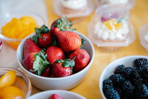 Free Strawberries and Blueberries on Ceramic Bowls Stock Photo