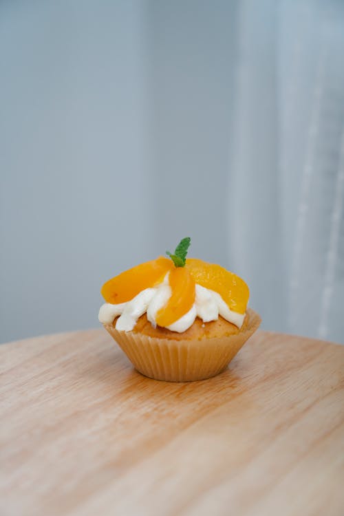Cupcake with Cream and Fruit Garnish 