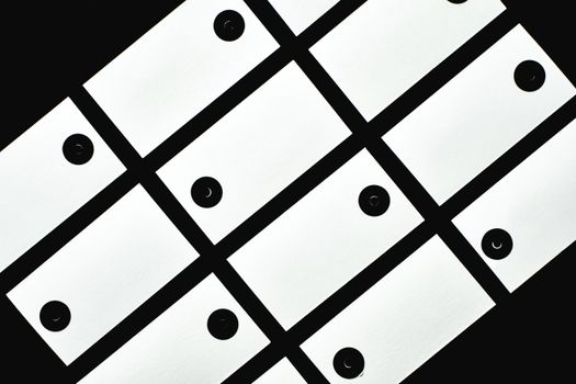 Stylish abstract geometric pattern in black and white with blank tags.