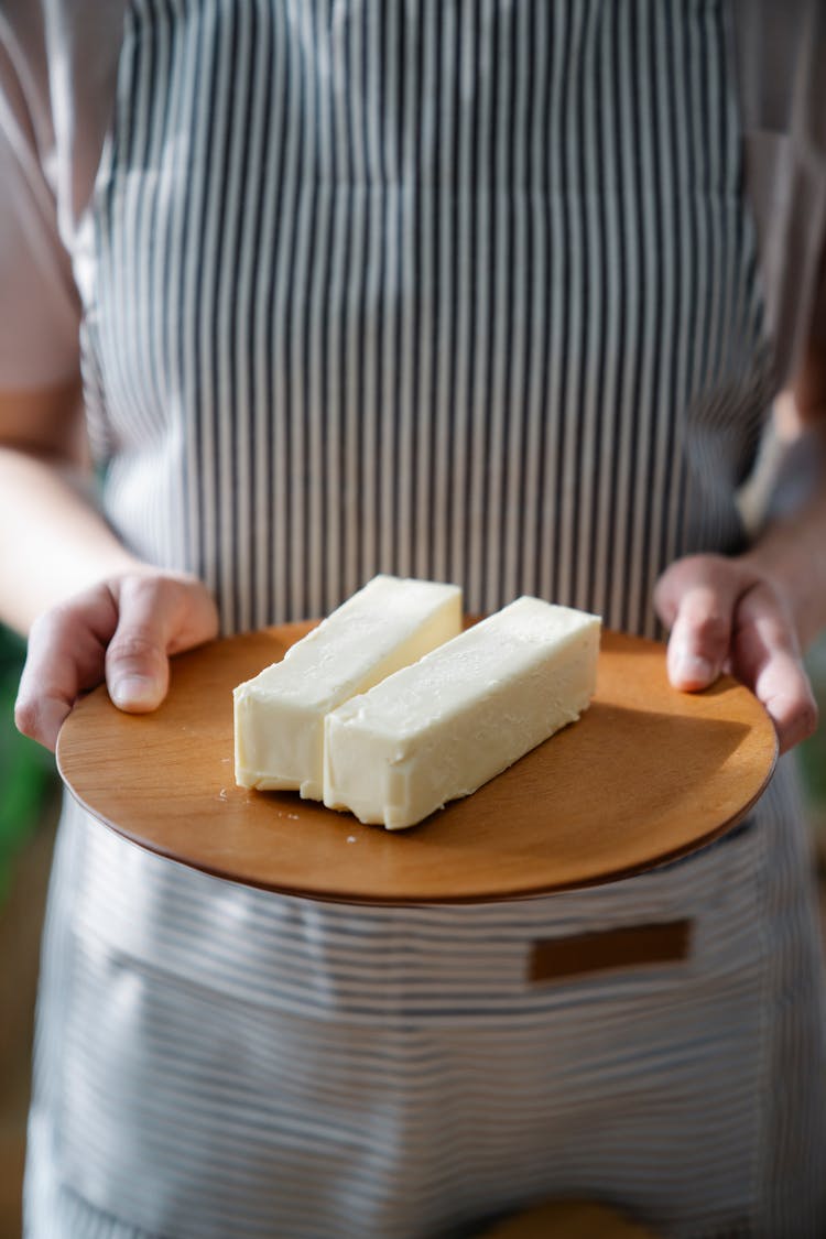 Chef With Butter On Plate