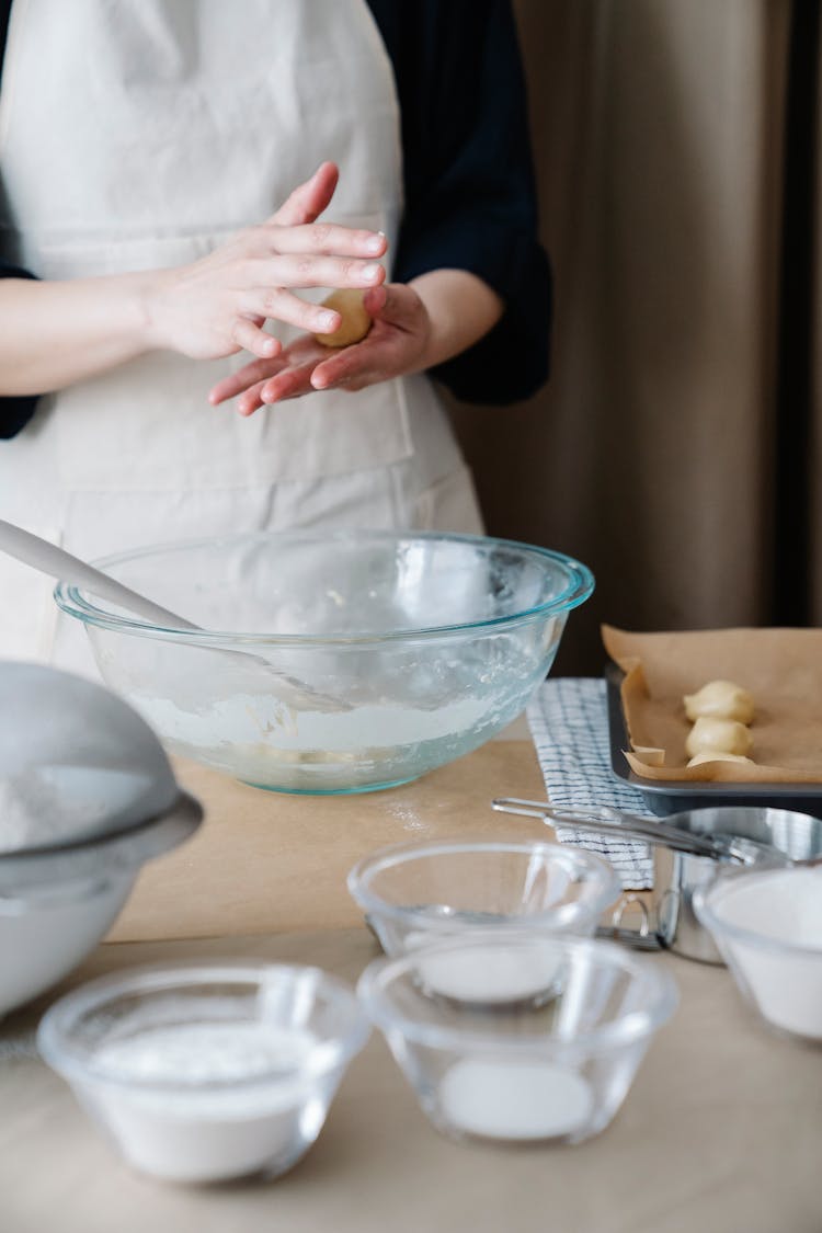 Person Shaping A Dough