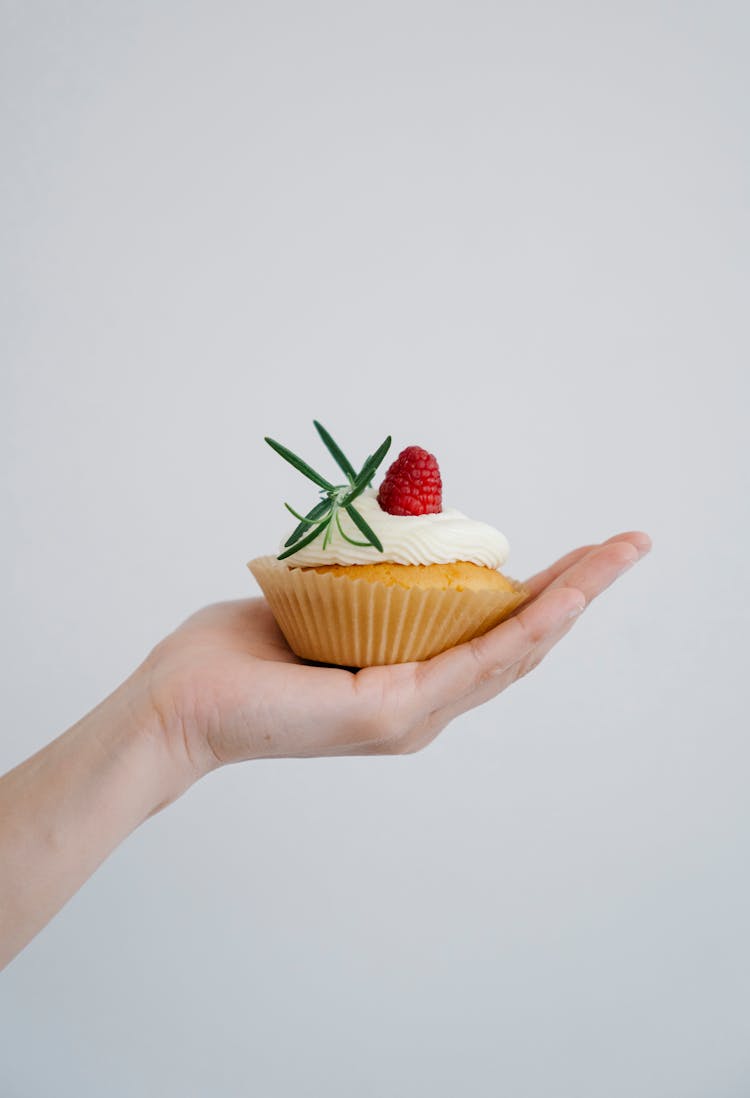 Person Holding A Cupcake