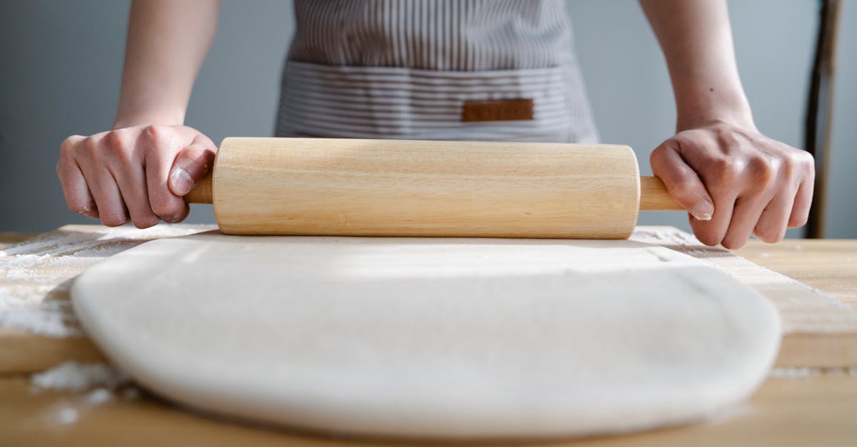 Close Up of Woman Rolling Pastry · Free Stock Photo