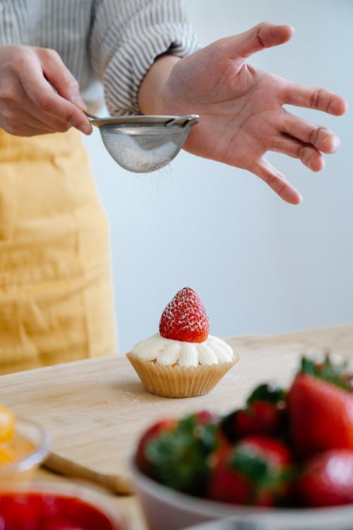 Free Person Holding Stainless Steel Spoon With Strawberries Stock Photo