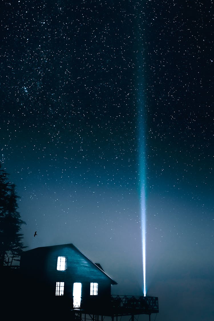 Light Beam Across A Starry Night Sky