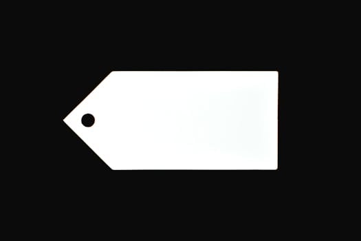 A white blank price tag against a black background, perfect for commercial use.