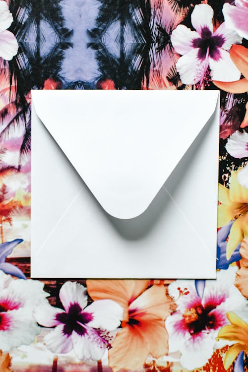 White Envelope on Floral Background