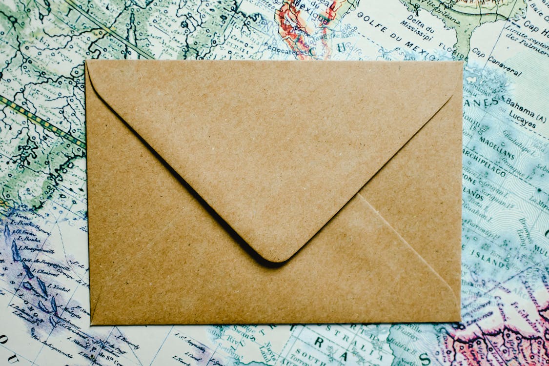 Brown Envelope on White and Black Textile