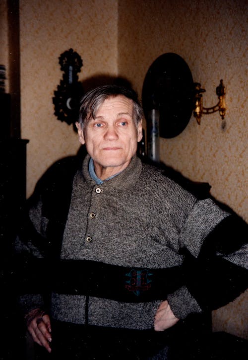 Elderly Man in Black and Gray Sweater