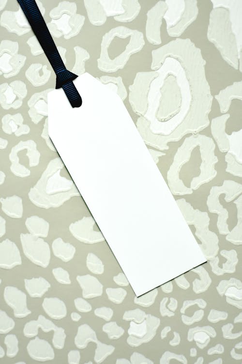 A White Tag on a Green Surface