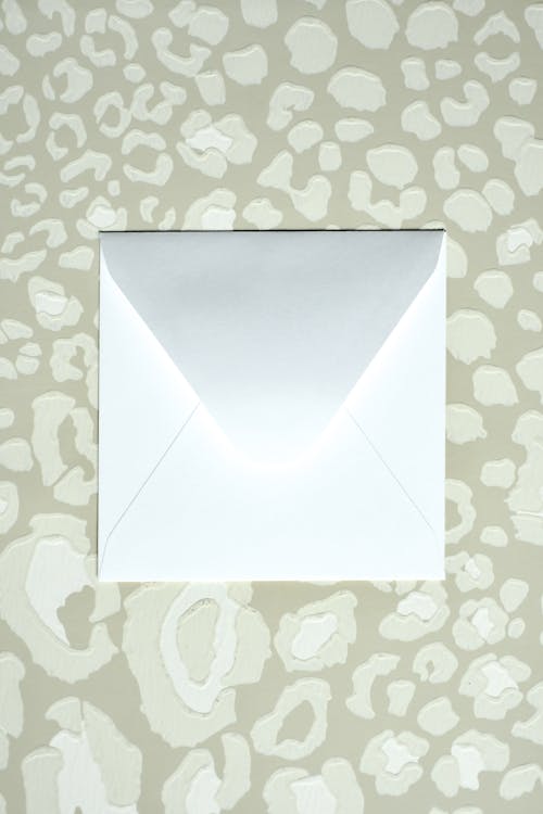 White Envelope on Pattern Background