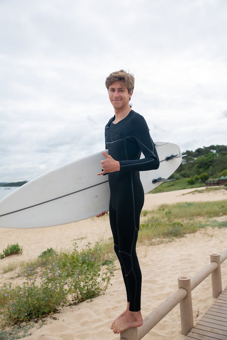 A Boy Wearing A Black Wetsuit