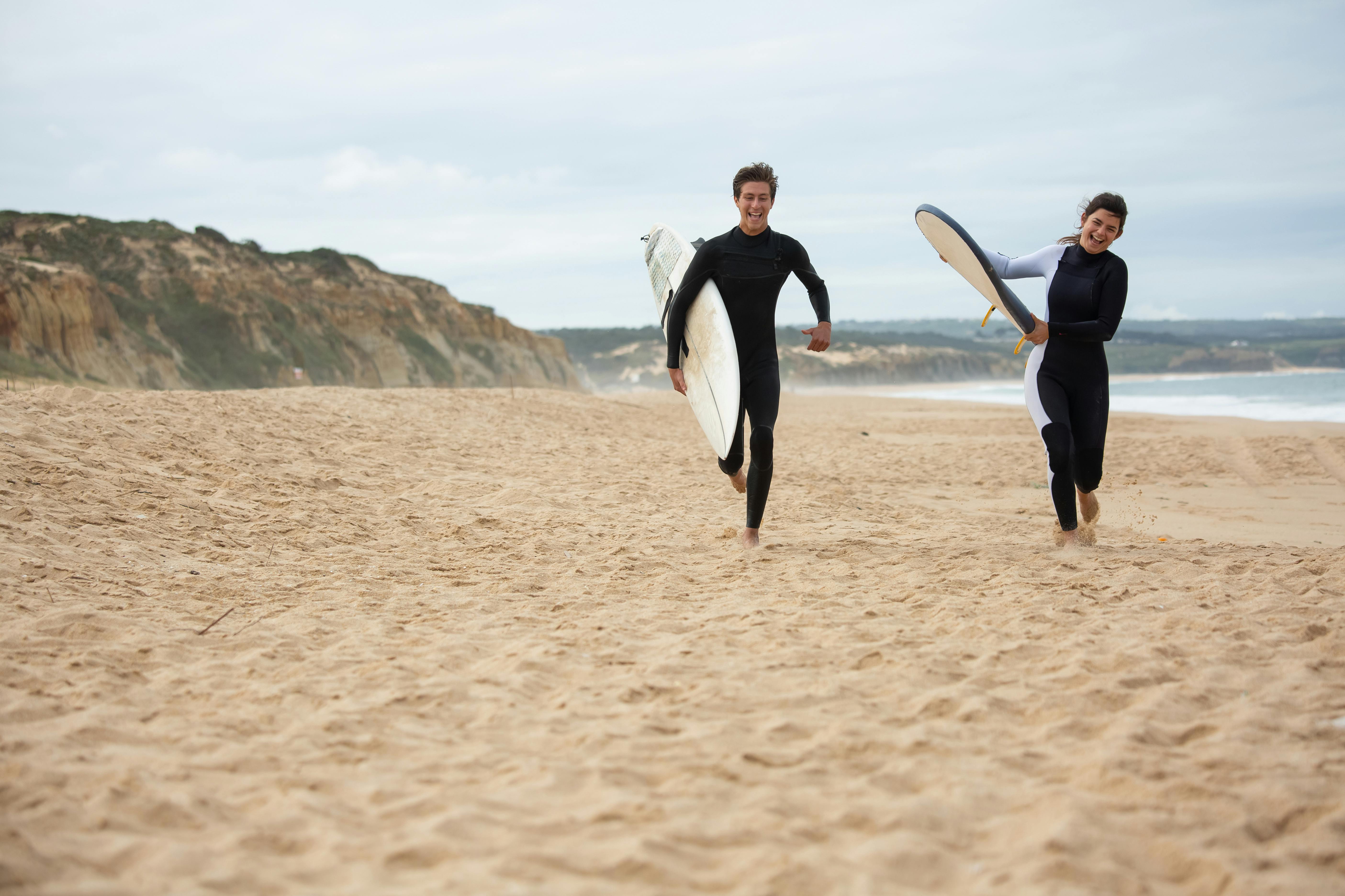 Surfers Running at the Beach · Free Stock Photo