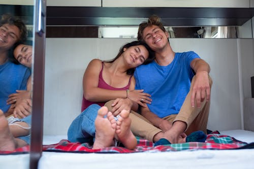 Free A Couple Resting Inside a Room Stock Photo