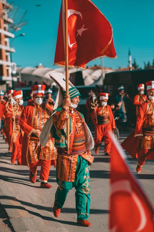 Free People Wearing Costumes in a Street Parade Stock Photo