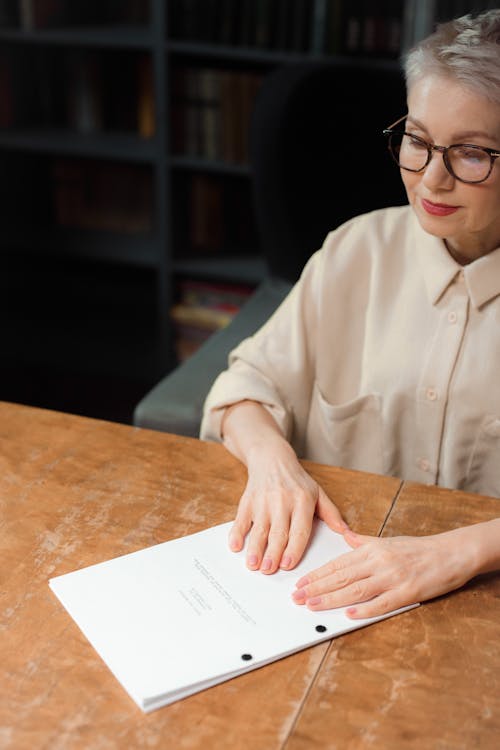 An Elderly Woman Holding a Manuscript