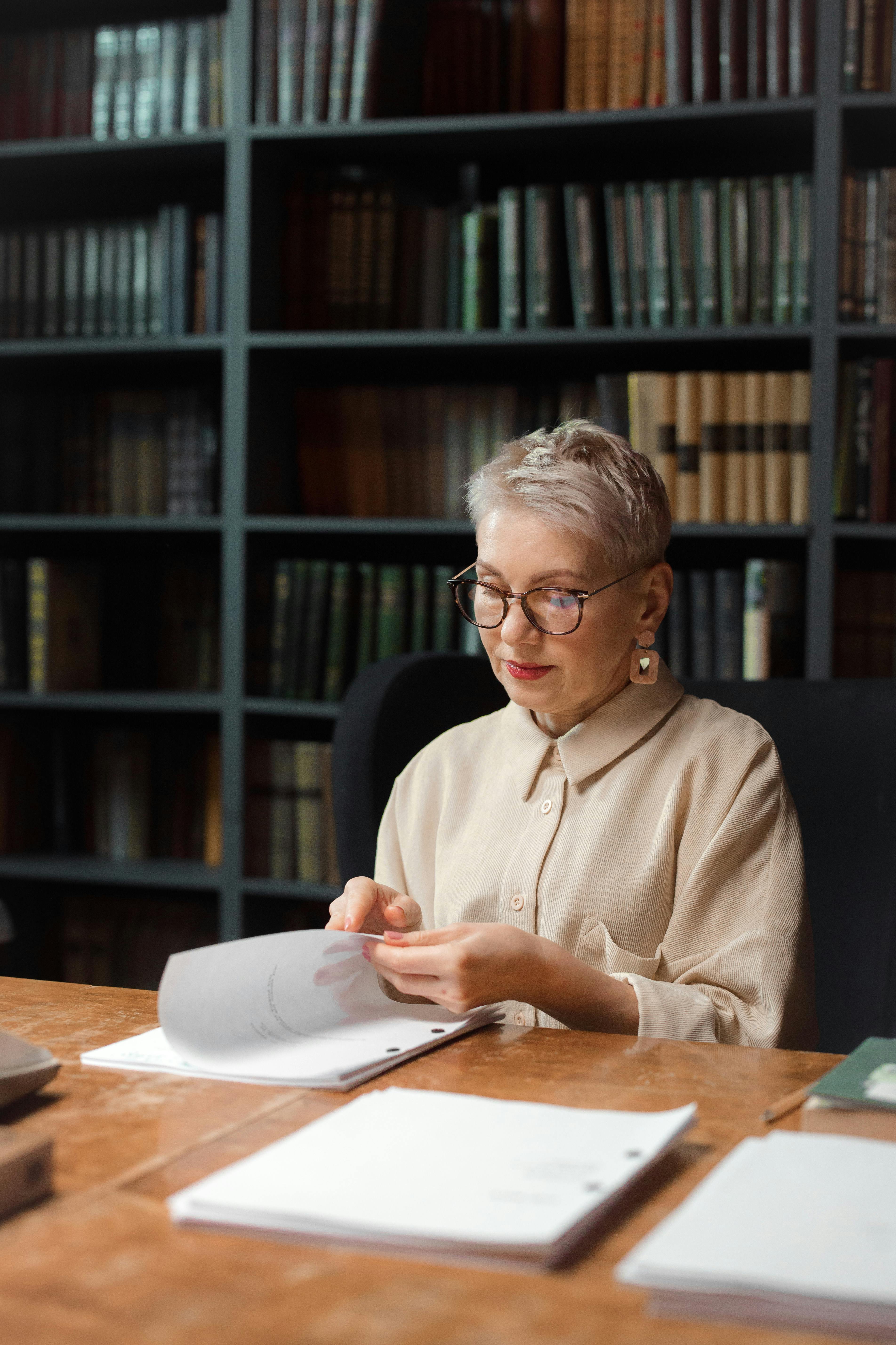 professional drama professor looking at a script