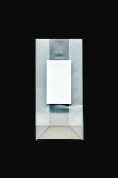 Overhead view of a paper bag with a blank label, ideal for branding mockups.