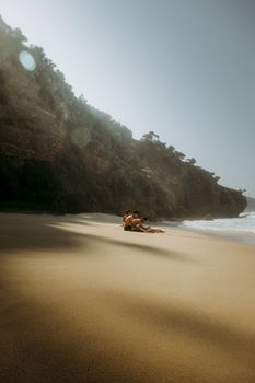 A serene day at a secluded beach with people relaxing by the sea.