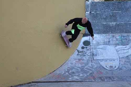 Skateboarder doing Tricks on a Ramp 