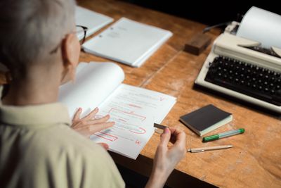 Typewriter on a desk in low light, photo by Ron Lach on Pexels