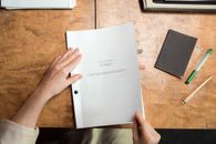 Person Holding White Printer Paper