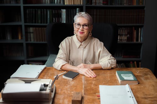 An Elderly Woman with Eyeglasses Sitting