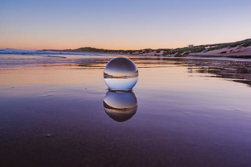 Close-Up Shot of a Lensball on the Beach