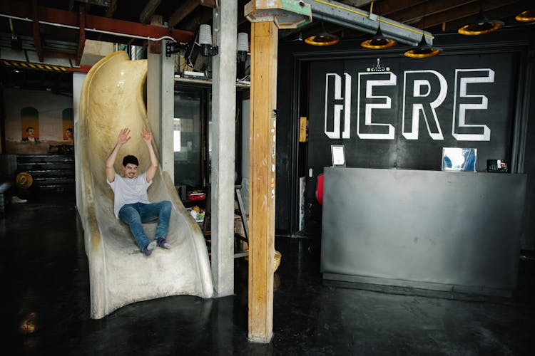 Man Going Down A Slide