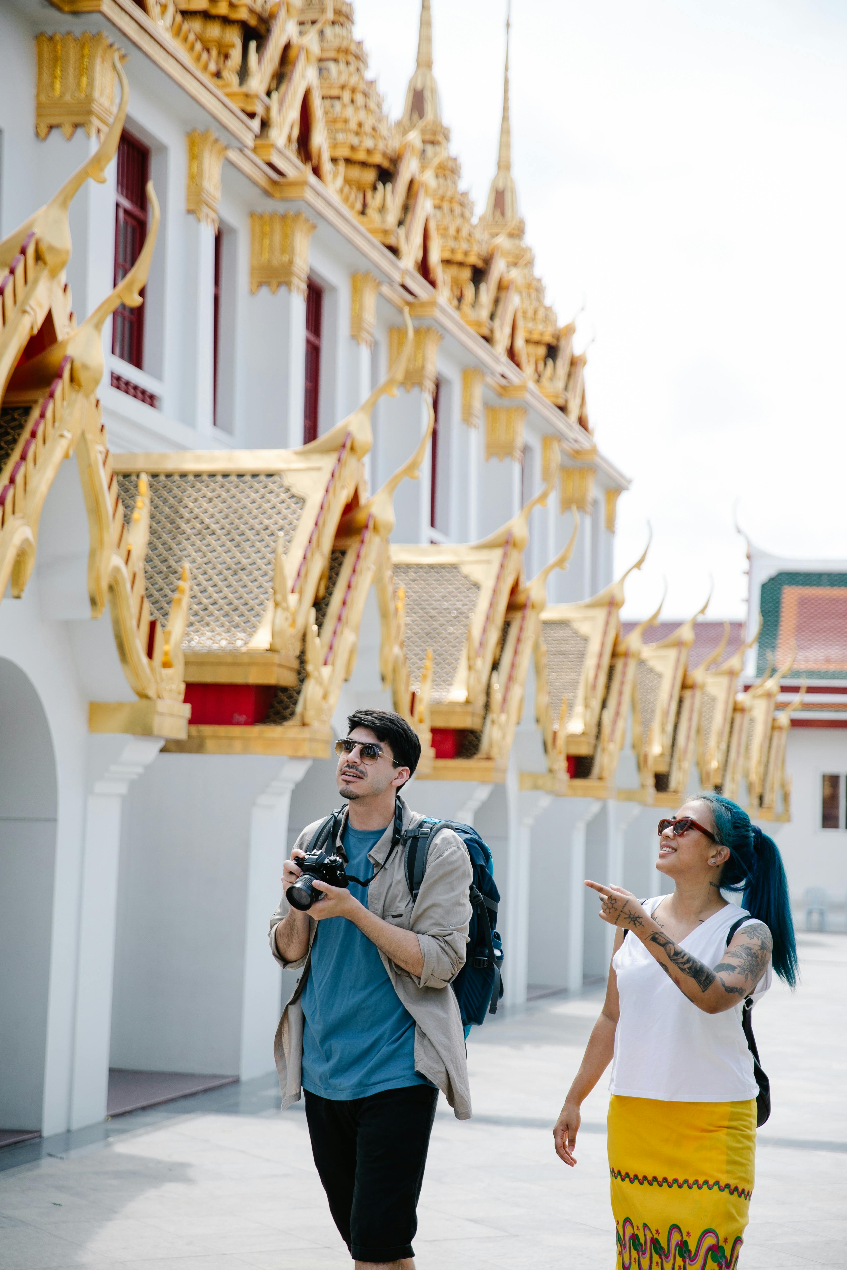 couple walking near the temple