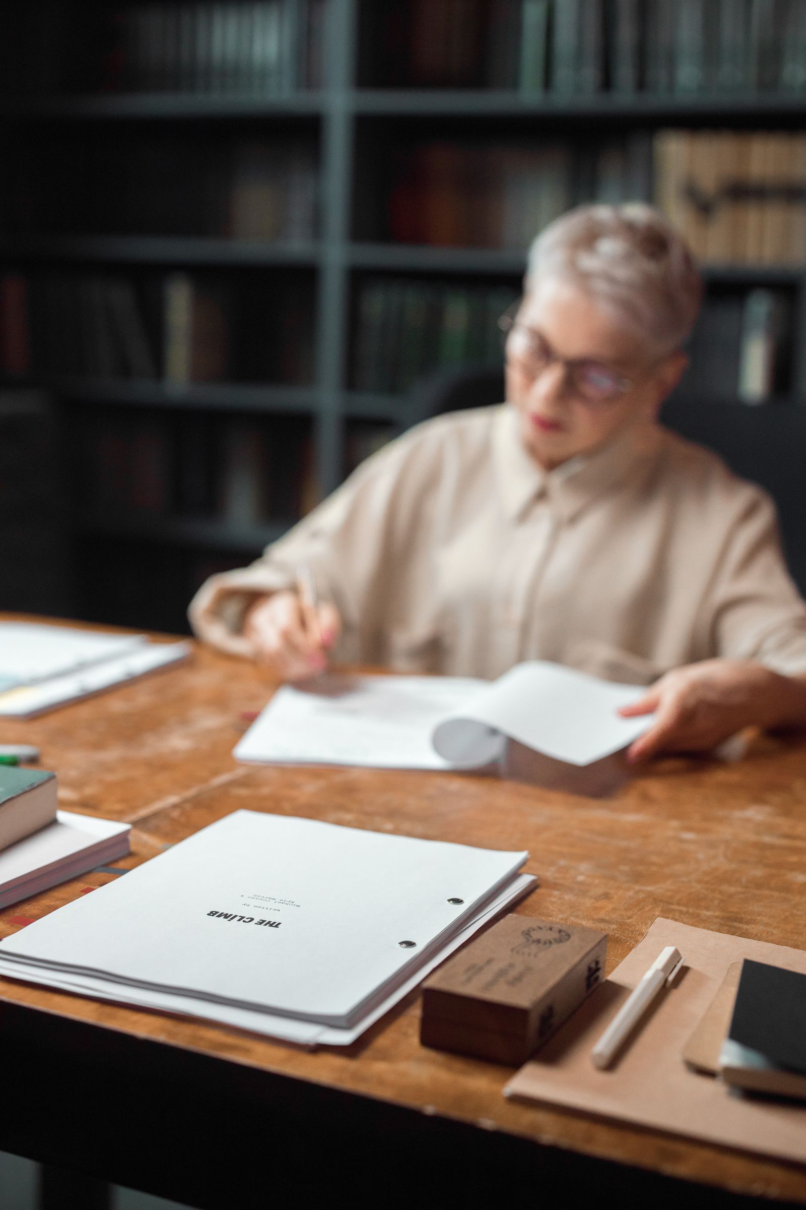 A writer carefully editing a family memoir manuscript