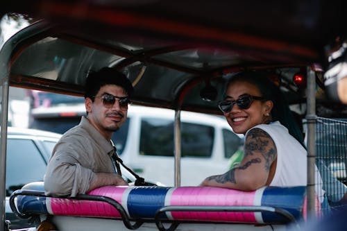 Man and Woman Riding an Auto Rickshaw