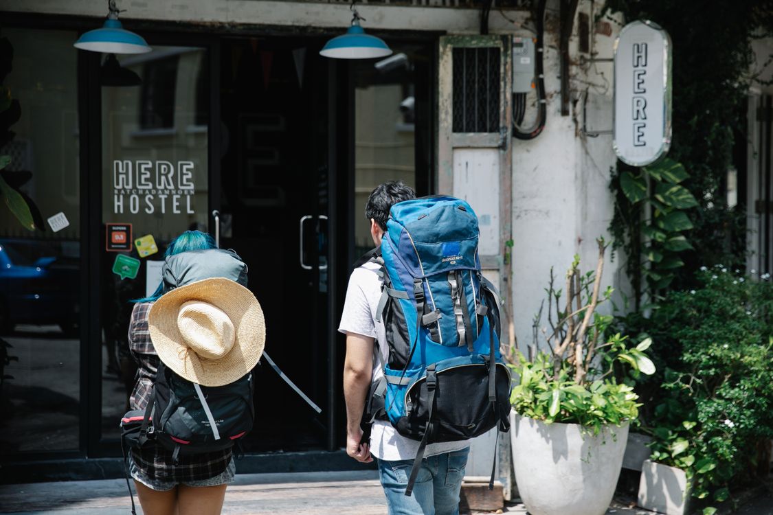 Go Inside Man and Woman About to Go Inside a Building · Free Stock Photo