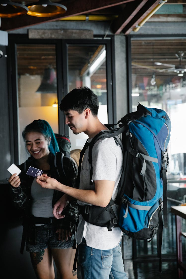 Tourists Holding Tickets