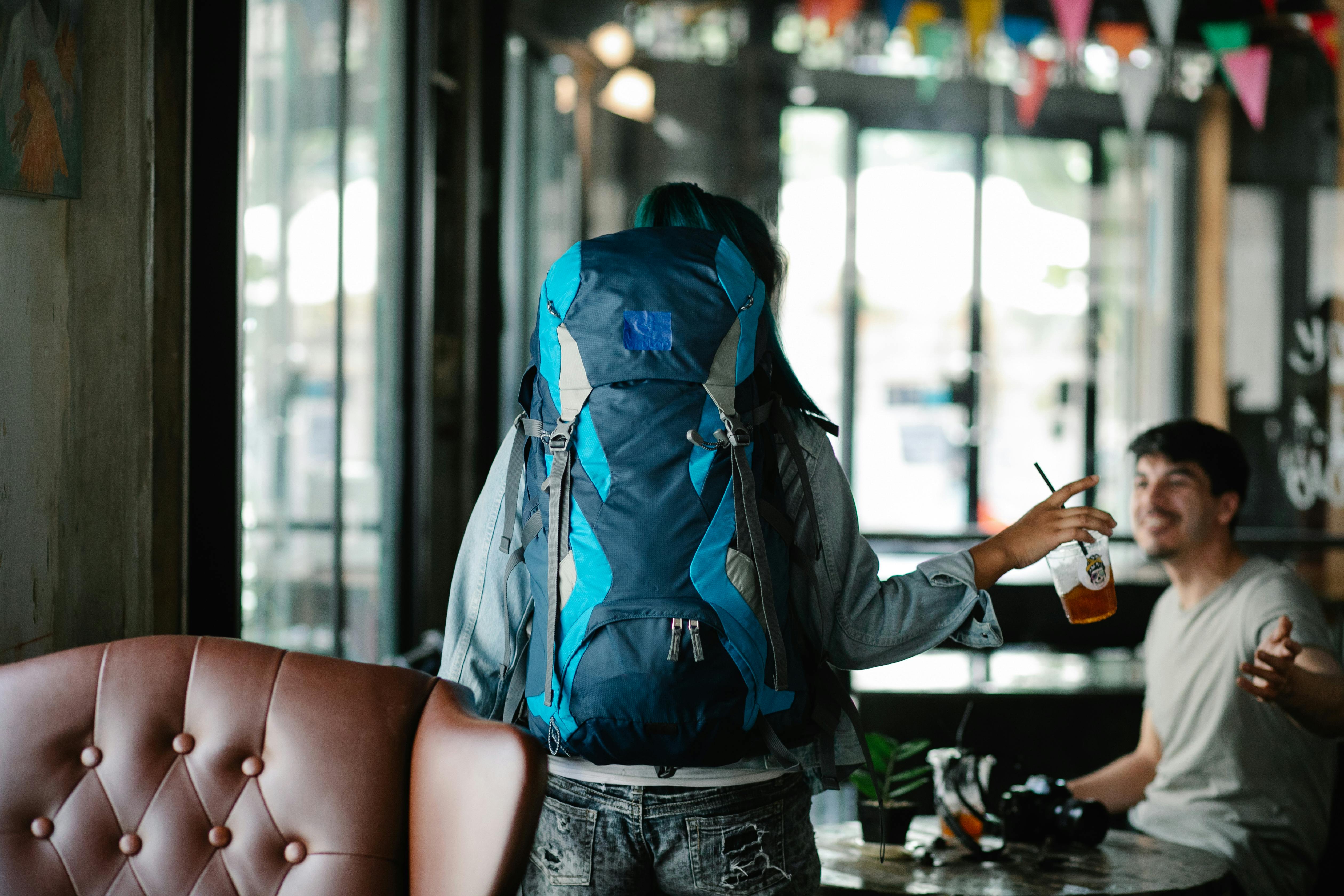 Person with Backpack and Beer · Free Stock Photo