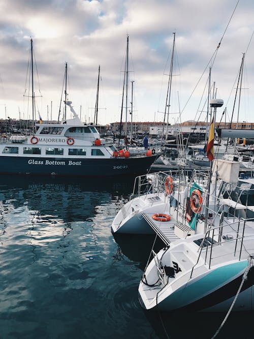 Free Photo of Different Kinds of Boats at a Harbor Stock Photo