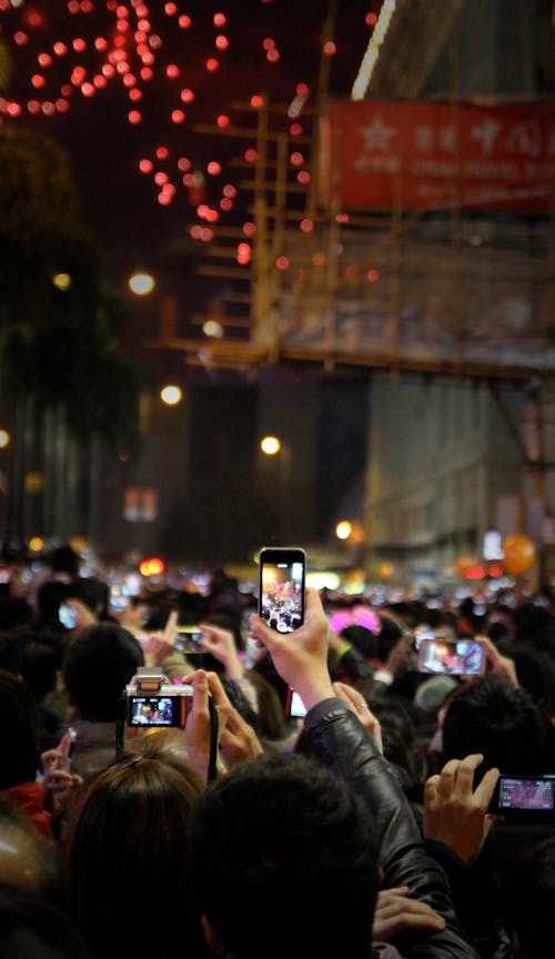 Crowd of People Taking Video