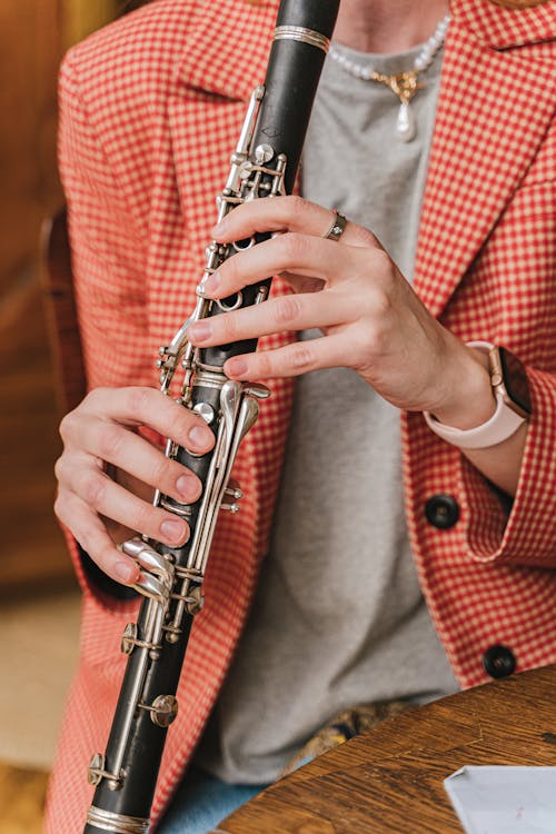 Free Close-Up Shot of a Person Playing Flute Stock Photo