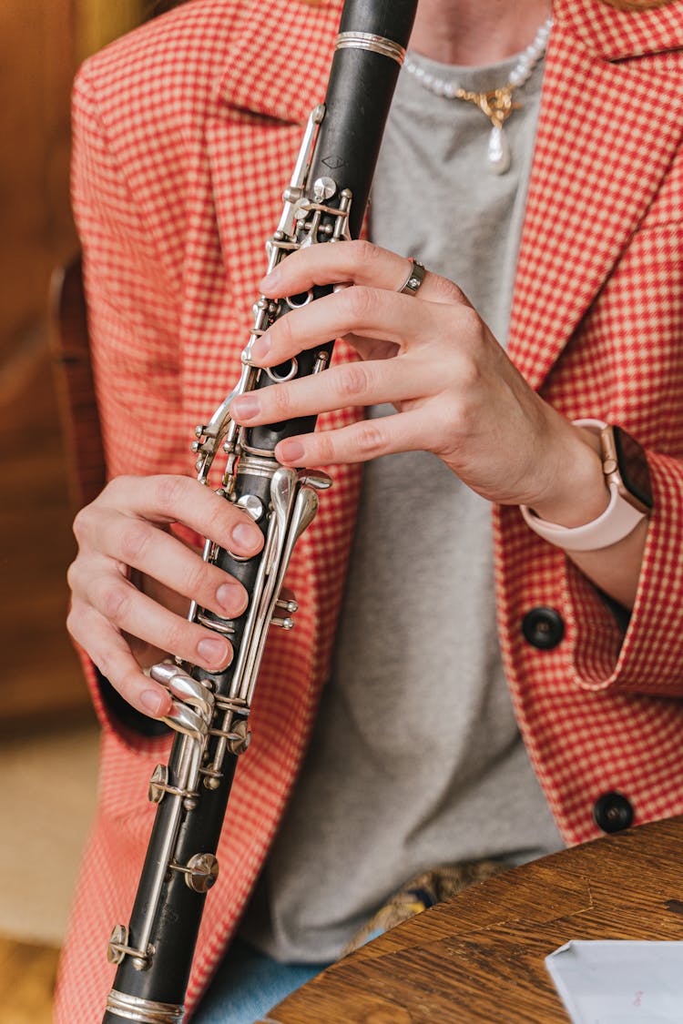 Close-Up Shot Of A Person Playing Flute